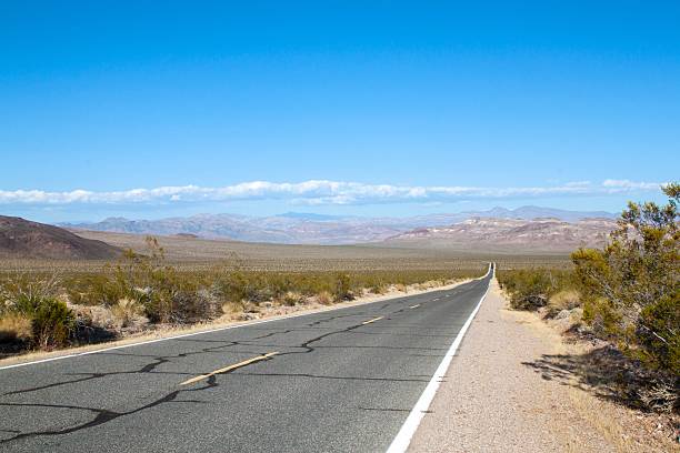 istock California Desert Highway with blue sky 488499721