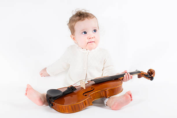 istock Little girl playing with a violin 488499837