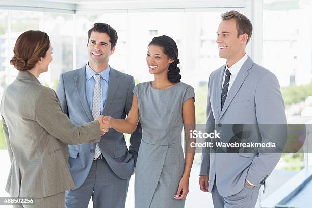 Business Team Meeting Their Partner Stock Photo - Download Image Now - Businesswear, Corporate Business, Dress