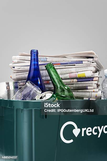 Recycling Bin Filled With Waste Paper And Bottles Closeup Stock Photo - Download Image Now