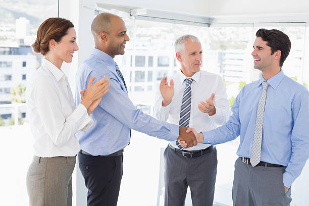istock Business team congratulating their colleague 488506032