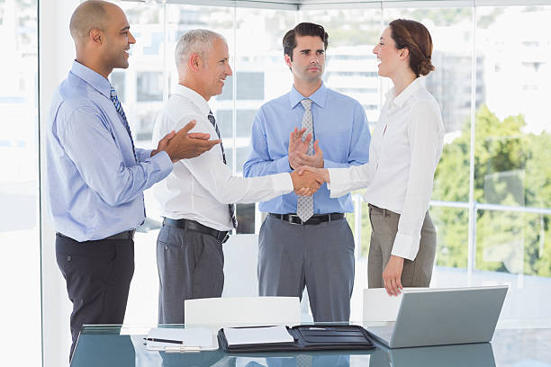 istock Business team congratulating their colleague 488506078