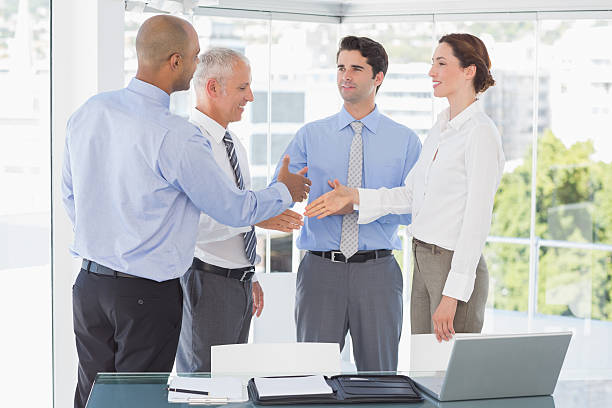 istock Business team congratulating their colleague 488506110
