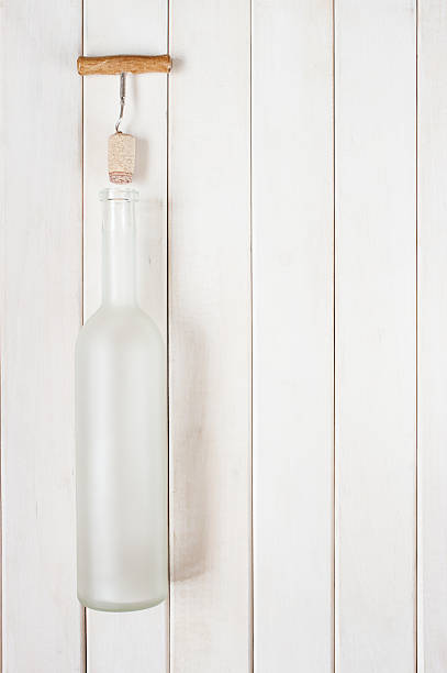 istock Matte glass bottle empty on the white wooden table 488507434