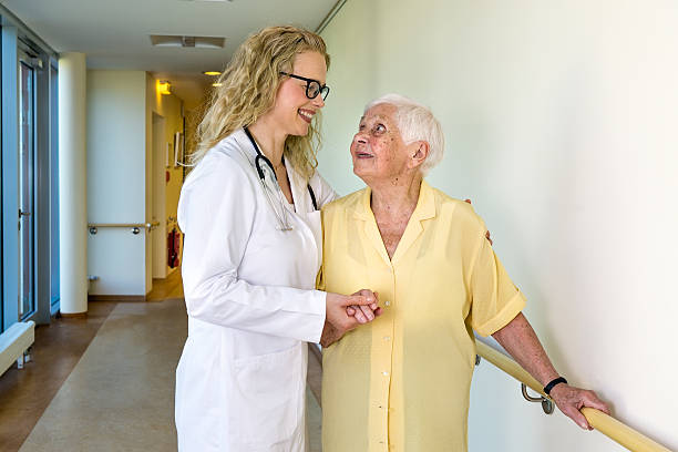 istock Medical Assistant Assisting Elderly in Hospital. 488507808