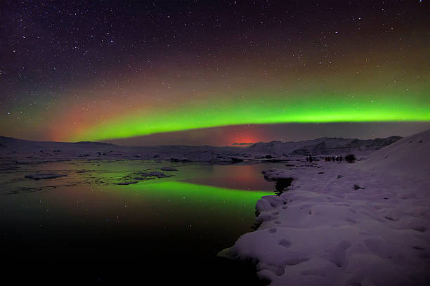 istock Mixed aurora dancing over the Jokulsarlon lagoon, Iceland 488508524