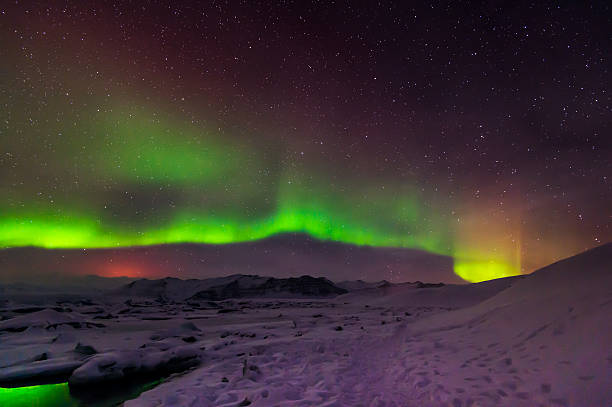 istock Mixed aurora dancing over the Jokulsarlon lagoon, Iceland 488508666