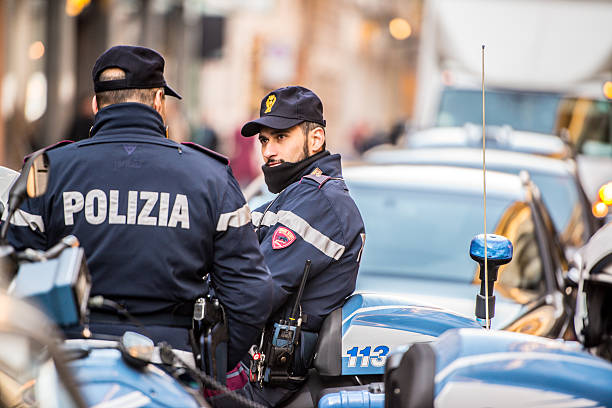 Milan, Italy  - December 22, 2014: Policemen on Via Monte Napoleone, Milan