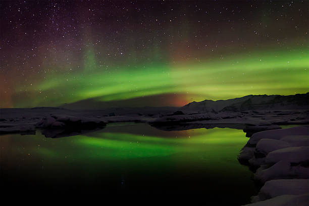 istock Mixed aurora dancing over the Jokulsarlon lagoon, Iceland 488508864