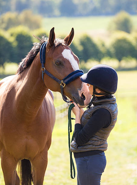istock Young woman bonding with her horse, Norway 488509710