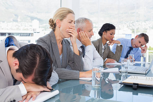 istock Tired business team at conference 488509806
