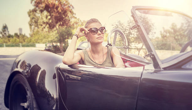 istock Beautiful woman in cabriolet 488512800