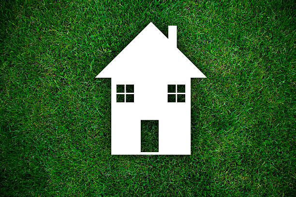 istock house against green field 488515428