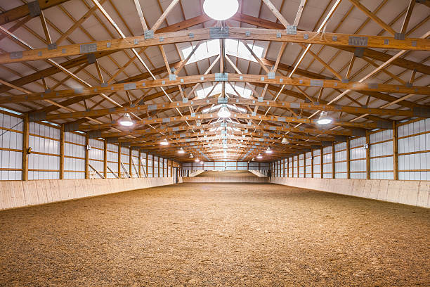 Vast Horse Barn, Equestrian Training and Practice Arena Vast Horse Barn, Equestrian Training and Practice Arena. horse barn stock pictures, royalty-free photos & images