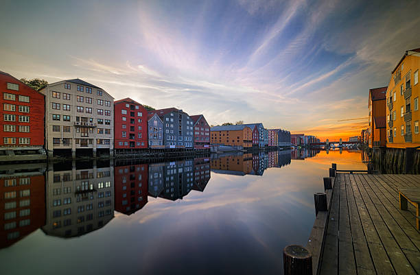 Through Trondheim flows The Nidelva, with old storehouses flanking both sides of the river.