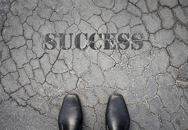 istock Black shoes standing on damaged floor with his broken success 488518356