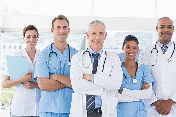 istock Team of smiling doctors looking at camera 488518470