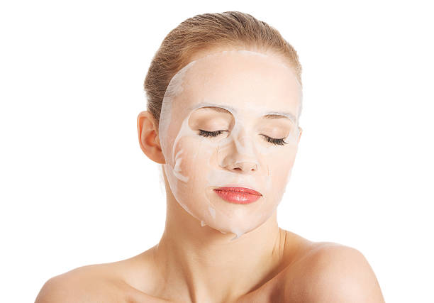 istock Beautiful woman with collagen mask on face. 488518727