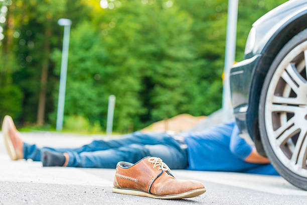 istock Traffic accident.Young man hit by a car 488518900