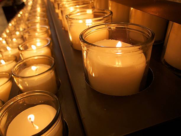 istock Lit Candles in a church 488519111