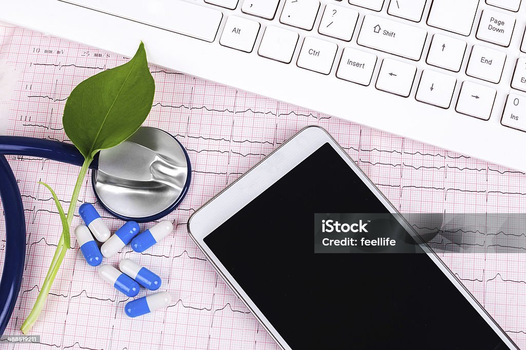 online medical service:X-ray and smartphone with stethoscope Care Stock Photo
