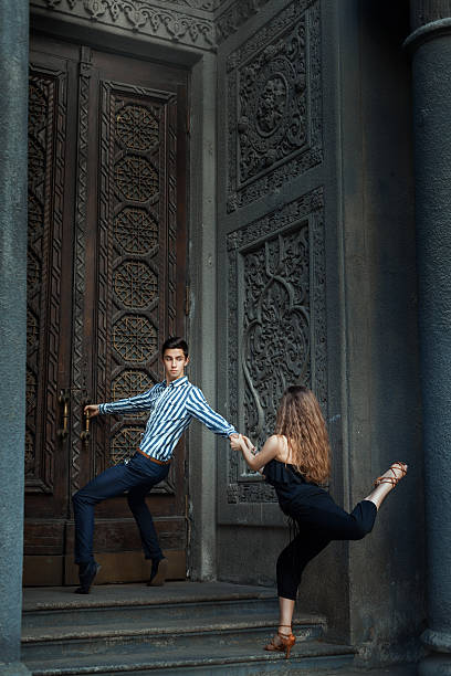 istock Man holding door handle and  girl to a guy, dance. 488519426