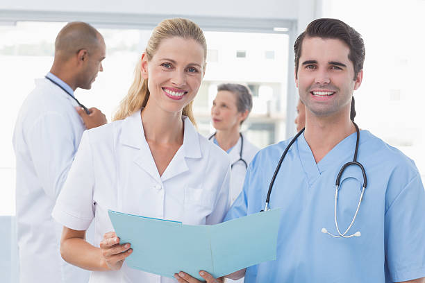 istock Team of doctors working on their files 488519452