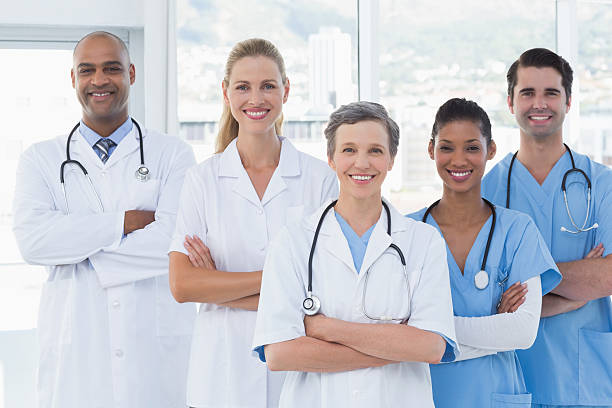 istock Team of smiling doctors looking at camera 488519538