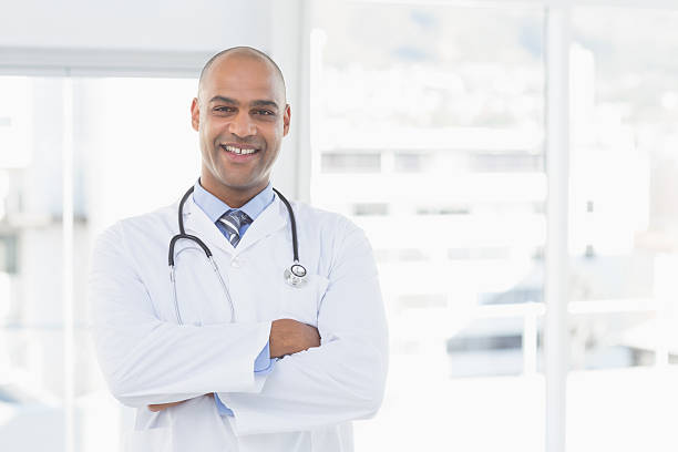 istock Confident male doctor smiling at camera 488520028