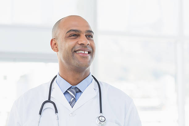 istock Confident male doctor smiling 488520096