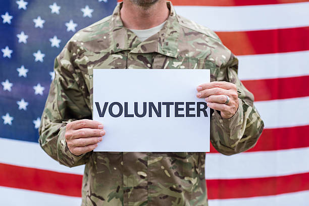 istock American soldier holding recruitment sign 488520360