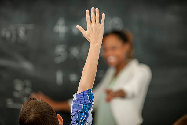 istock Little Boy Raising His Hand to Answer Question 488520436