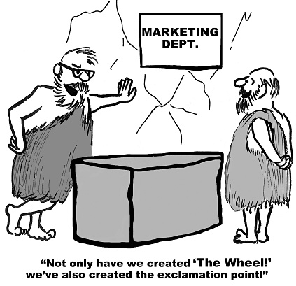 Business cartoon showing two stone age businessmen talking, 'Not only have we created 'The Wheel!' we've also created the exclamation point!'.