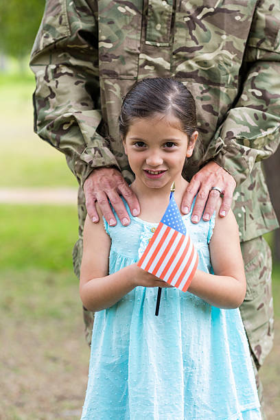 istock Soldier reunited with his daughter 488521184