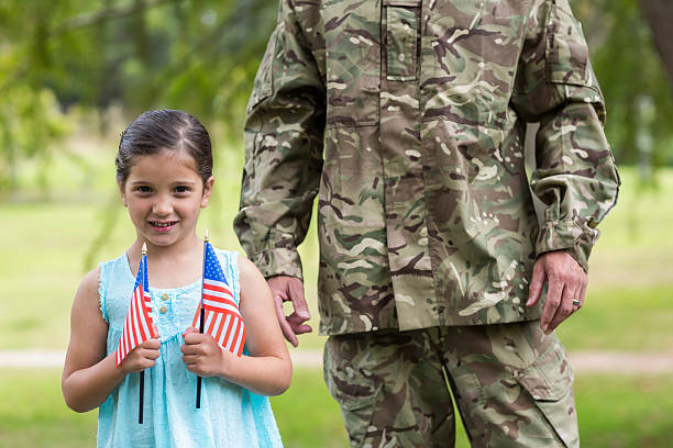 istock Soldier reunited with his daughter 488521210