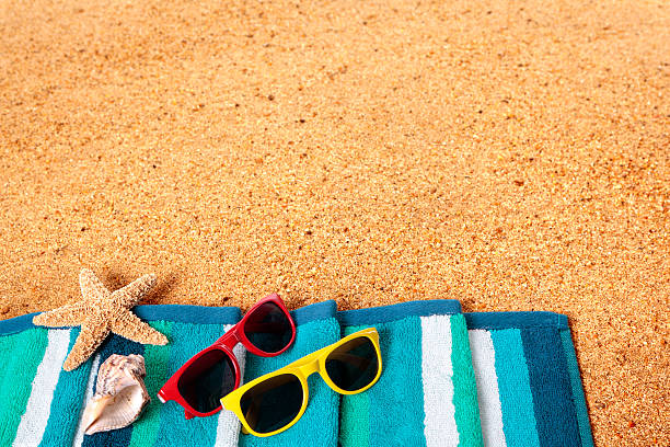 istock Beach background scene with sunglasses and starfish 488522953