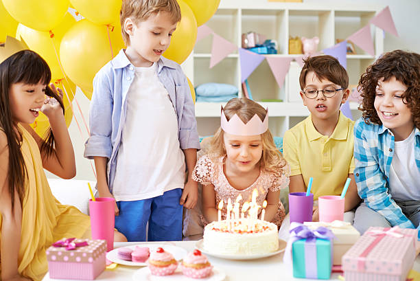 istock Blowing out birthday candles 488523163
