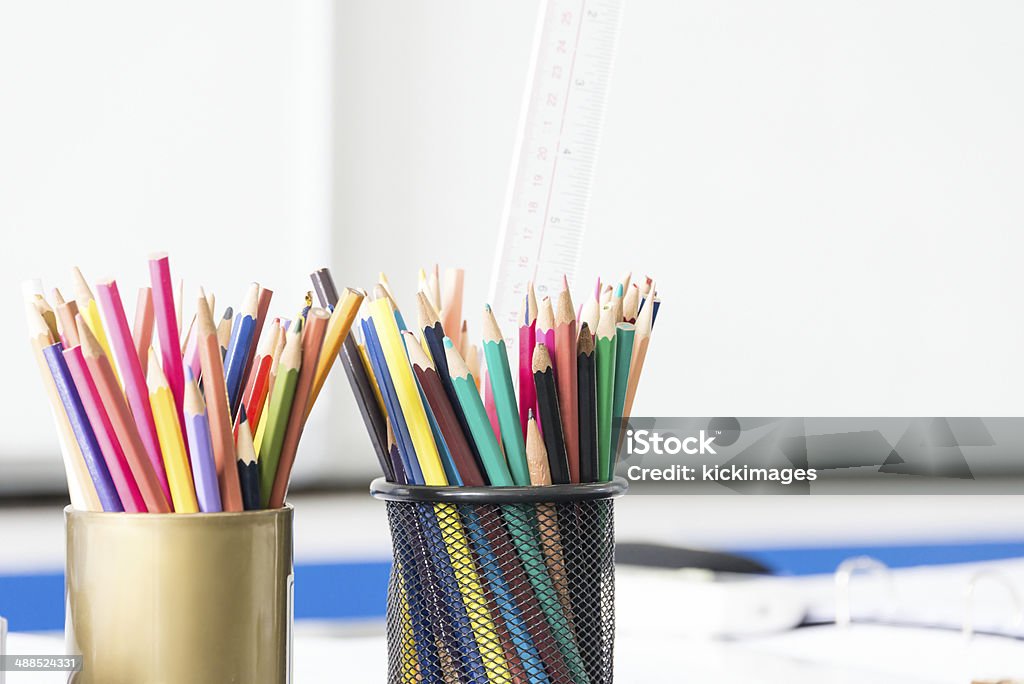Multicoloured Pencils Close-up of multicoloured pencils in container. Basket Stock Photo