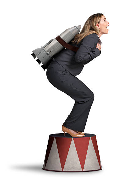 istock Businesswoman Preparing For Take Off On Circus Pedestal 488525868
