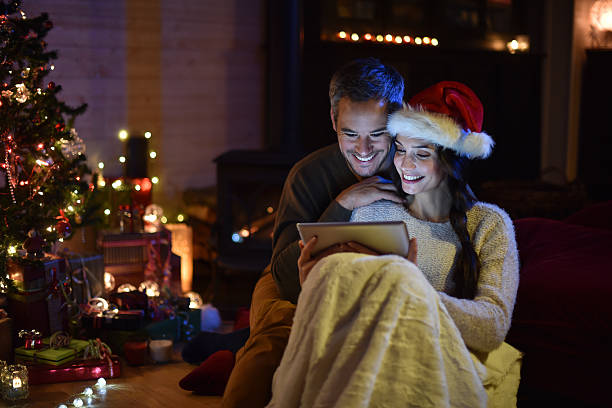 istock couple using a digital tablet at christmas eve 488526166