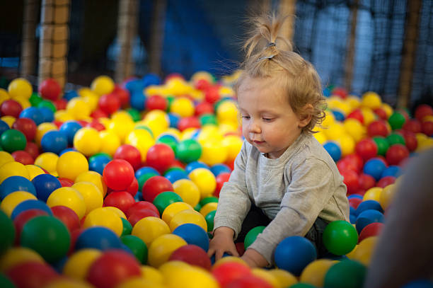 istock Baby girl in ball pool 488526443