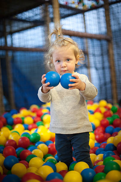 istock Baby girl in ball pool 488526449