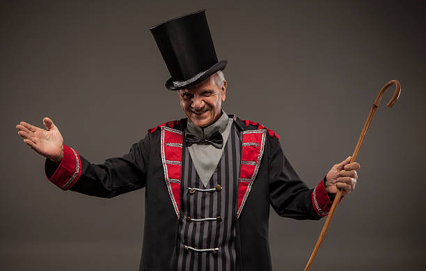 istock Carnival ticket salesman with big top hat. 488526502
