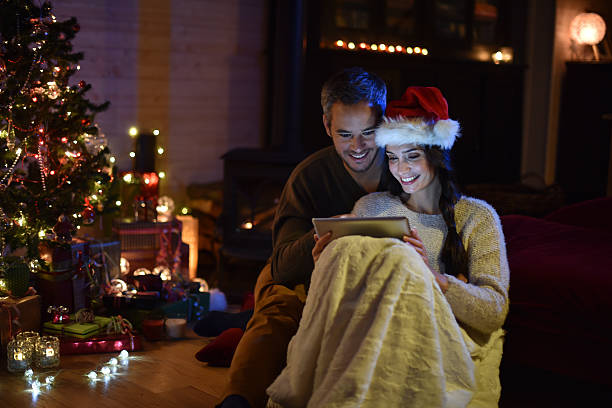istock couple using a digital tablet at christmas eve 488526560