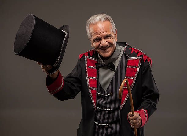 istock Carnival ticket salesman tipping his hat. 488526652