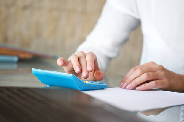 istock Accountant calculating taxes closeup 488526732