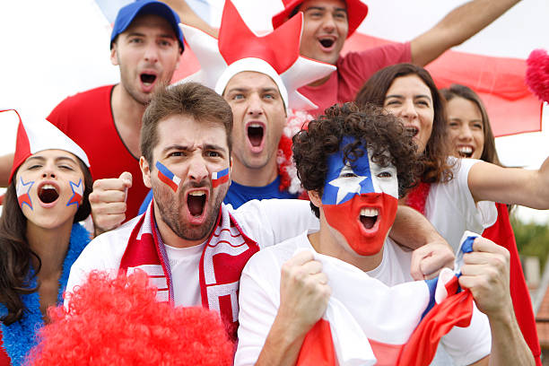 Fans of Chile A group of fans of Chile cheer for their team chilean ethnicity stock pictures, royalty-free photos & images