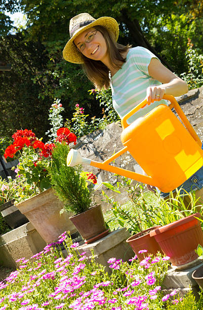 istock Young woman gardener 488528894