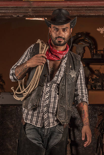 istock Cowboy holding lasso on his shoulder. 488529456