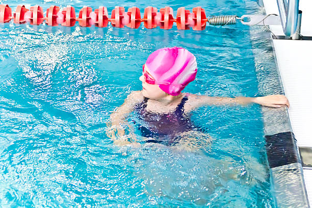 istock Girl in pink rubber hat 488529552